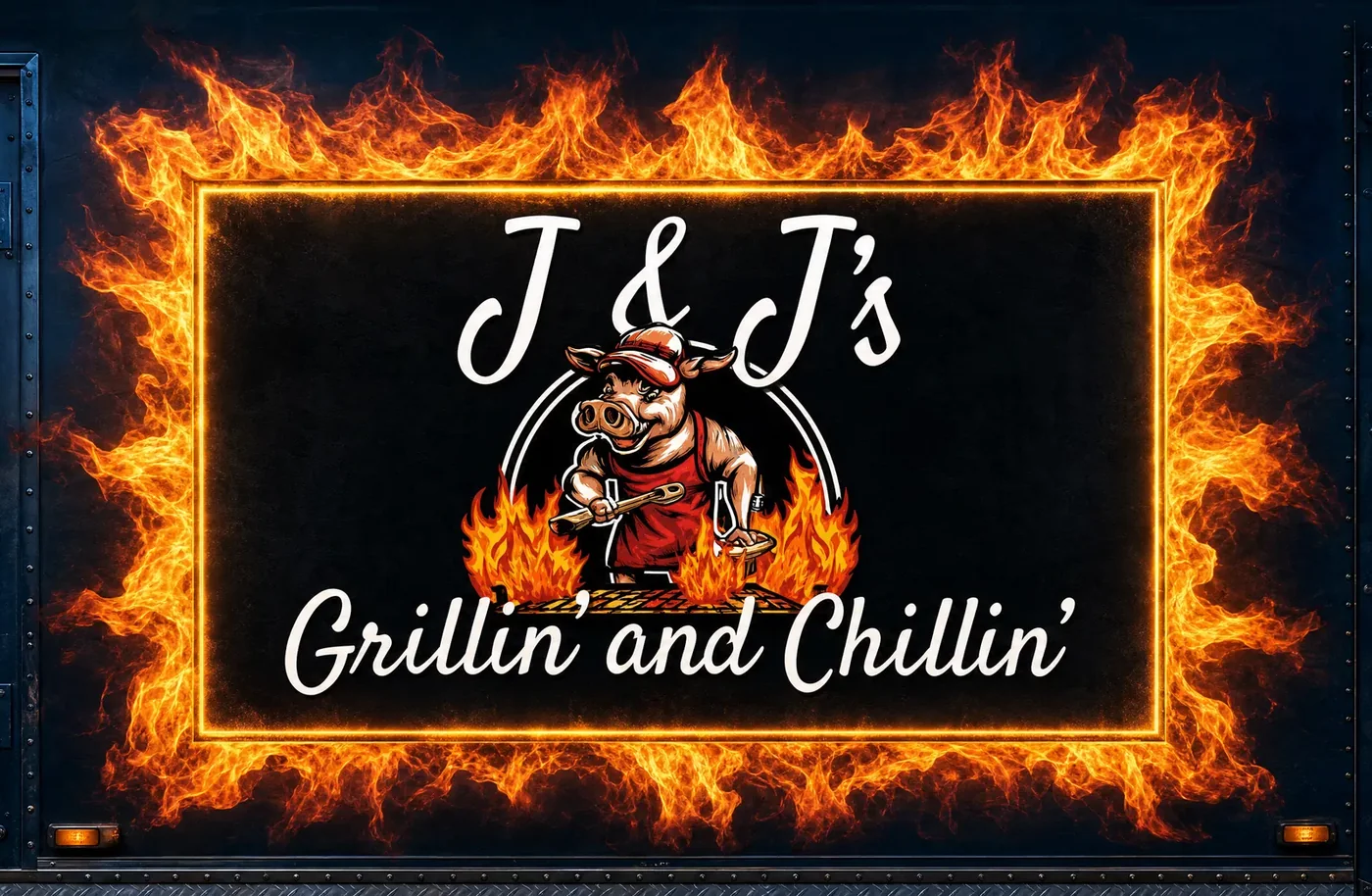 J and J's Grillin' and Chillin' fire-framed logo painted on the side of the truck